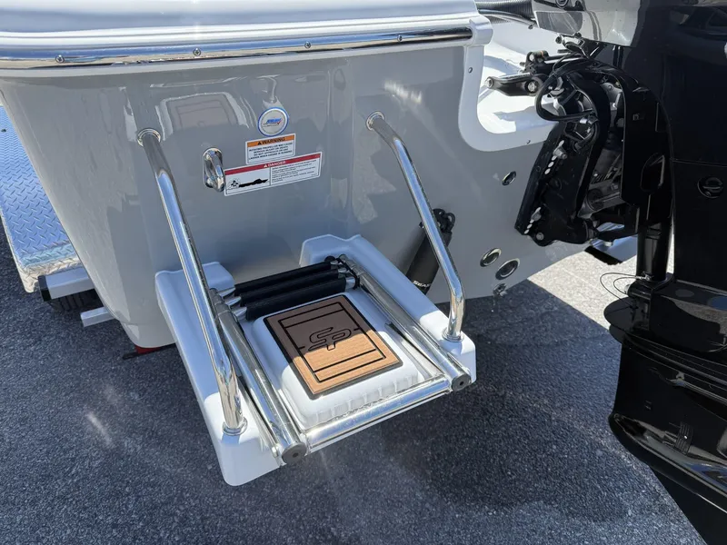 Slide: The Image of 2025 Sea Pro 230 Bay boat with a rear ladder and motor detail. - 7