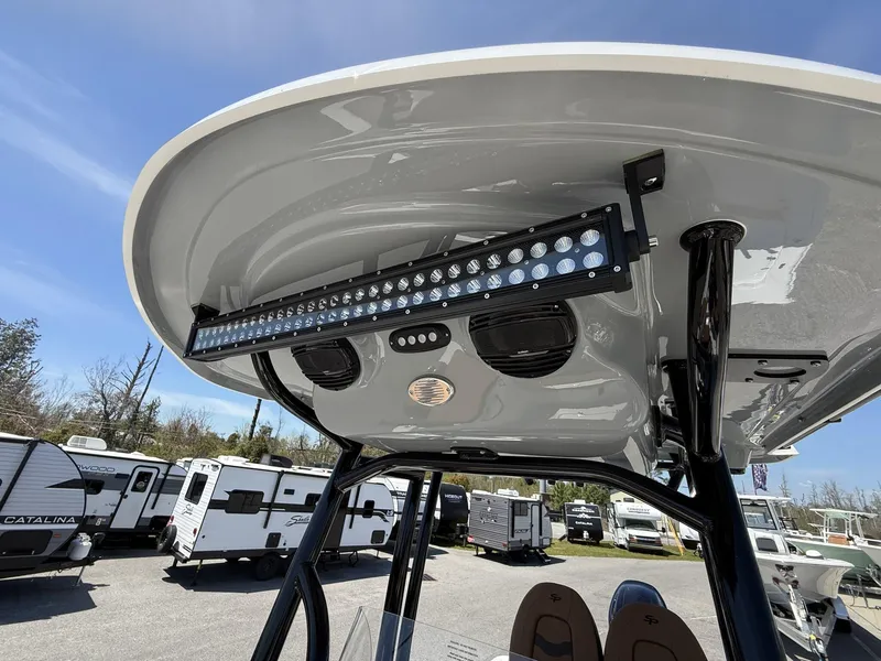 Slide: The Image of 2025 Sea Pro 230 Bay boat with LED light bar and speakers on T-top. - 8