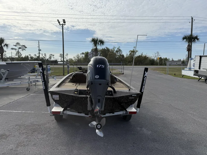 Slide: The Image of 2025 Xpress Hyper-Lift Bass Series boat with 175 HP engine on trailer. - 3