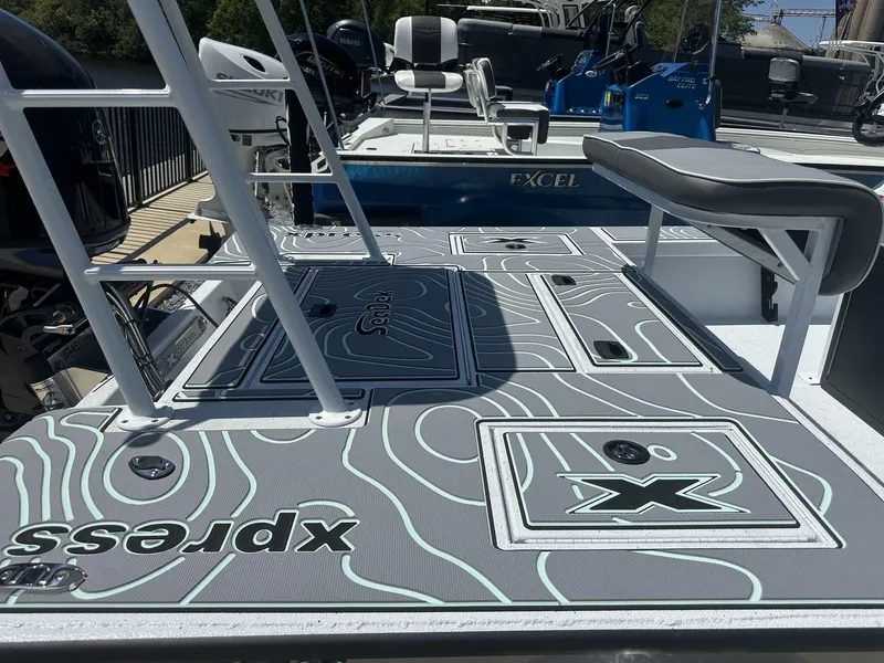 Slide: The Image of 2025 Xpress Skiff 185 boat deck with custom non-slip flooring. - 10