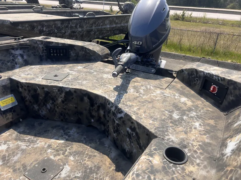 Slide: The Image of 2024 Excel RIVER WARRIOR 1651 boat with camouflage design and Yamaha 40 outboard motor. - 5