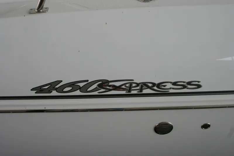 Slide: The Image of Cruisers Yachts 460 Express 2008 emblem on white hull. - 36