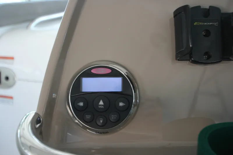 Slide: The Image of Control panel on 2008 Cruisers Yachts 460 Express dashboard, featuring buttons and display. - 19
