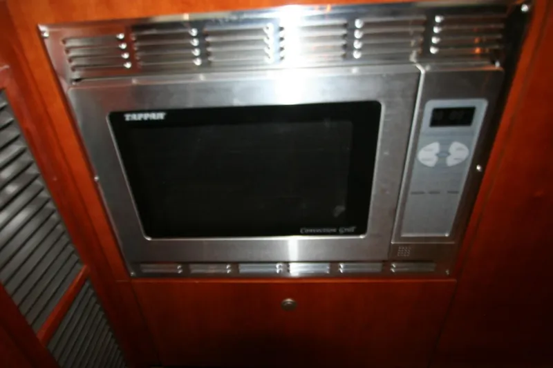 Slide: The Image of Control panel and vents in 2008 Cruisers Yachts 460 Express. - 23
