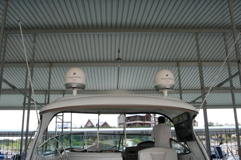 Slide: The Image of 2008 Cruisers Yachts 460 Express under covered dock. - 31