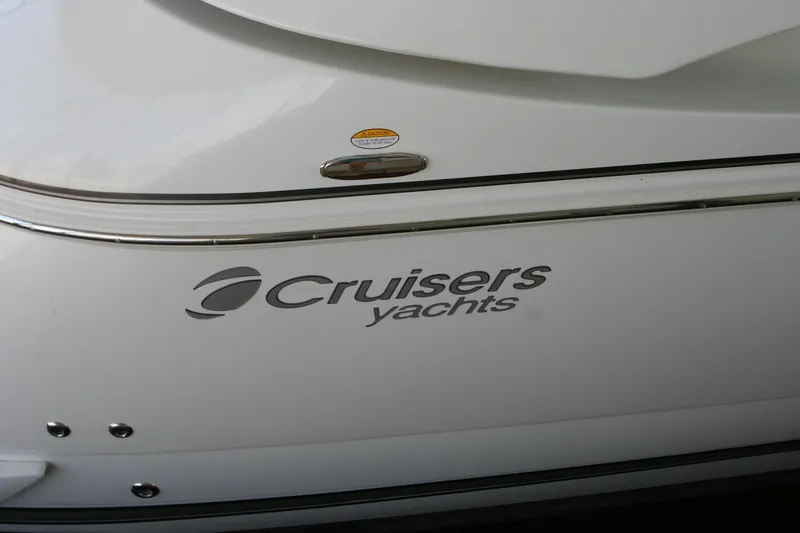 Slide: The Image of Cruisers Yachts 460 Express 2008 logo on white hull. - 35