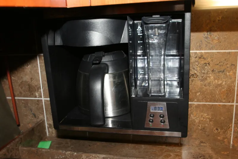 Slide: The Image of Built-in coffee maker on 2008 Cruisers Yachts 460 Express, featuring digital controls and stainless steel carafe. - 8