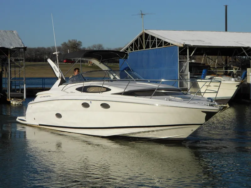 Slide: The Image of 2007 Regal 3360 Window Express boat docked at marina, side view. - 11