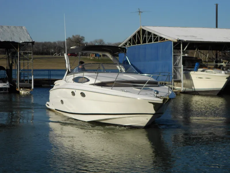 Slide: The Image of 2007 Regal 3360 Window Express boat docked at marina. - 12