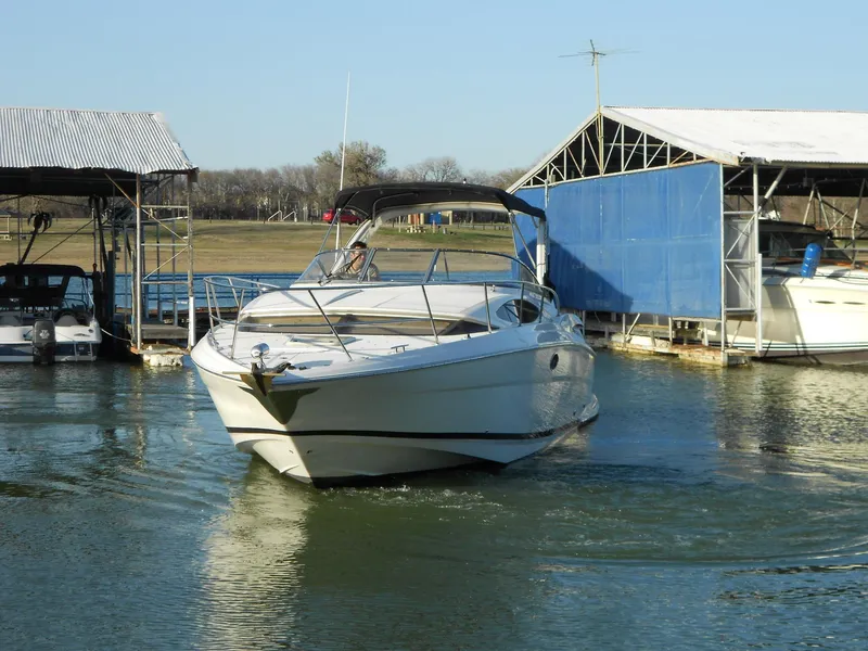 Slide: The Image of 2007 Regal 3360 Window Express boat docked at marina. - 13