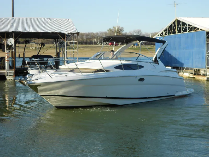 Slide: The Image of 2007 Regal 3360 Window Express boat docked in a marina. - 14