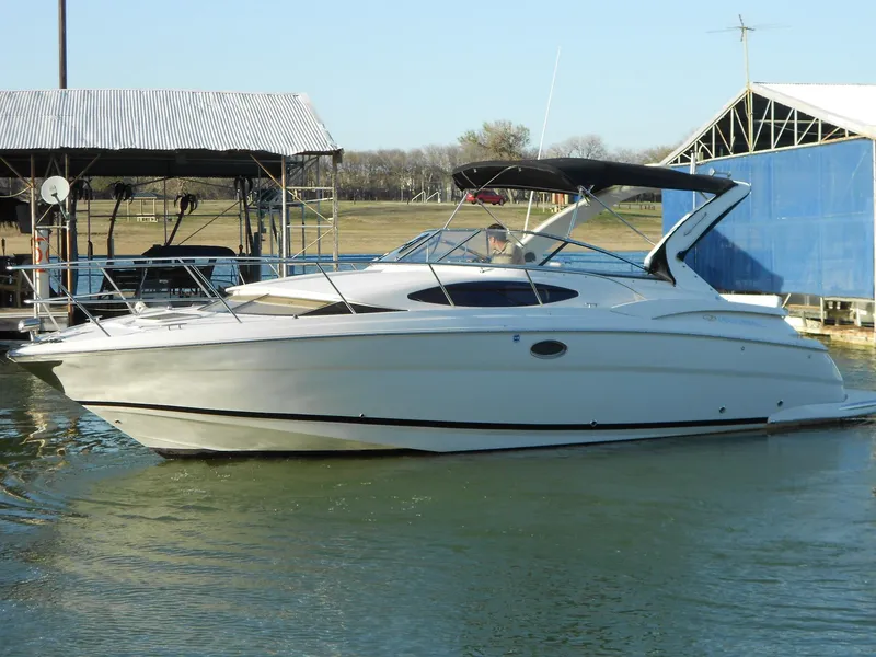 Slide: The Image of 2007 Regal 3360 Window Express boat docked on calm water. - 15