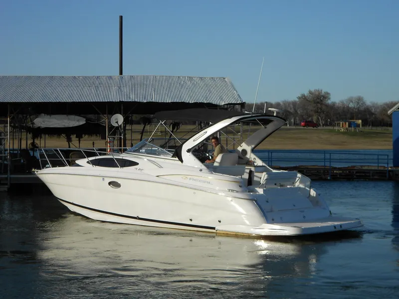 Slide: The Image of 2007 Regal 3360 Window Express boat docked on calm water. - 17