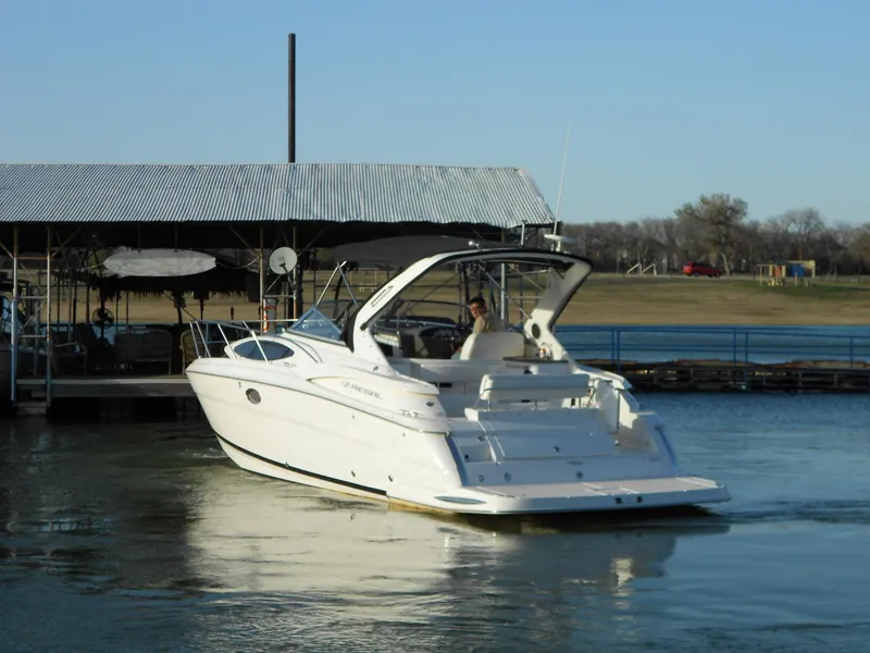 Slide: The Image of 2007 Regal 3360 Window Express boat docked on calm water. - 18