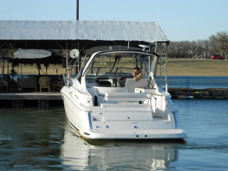 Slide: The Image of 2007 Regal 3360 Window Express boat docked at a marina, rear view. - 19