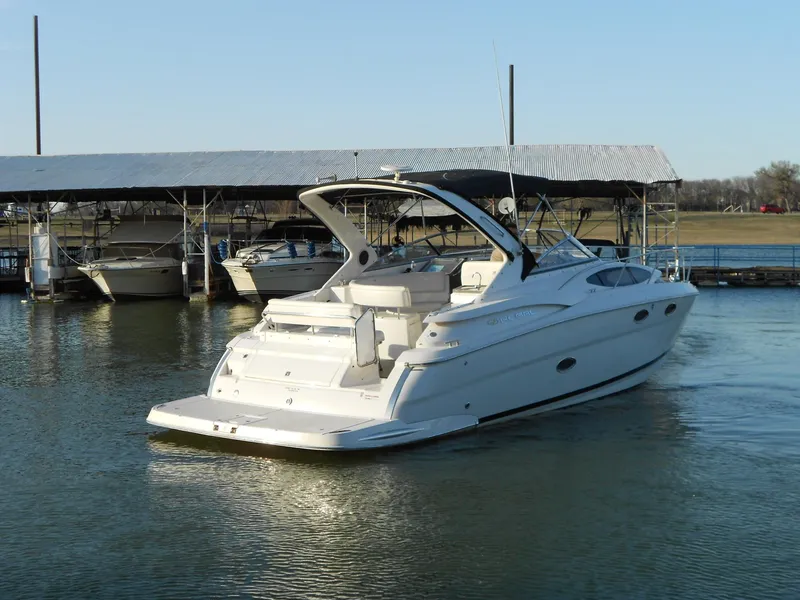 Slide: The Image of 2007 Regal 3360 Window Express boat docked on calm water. - 22