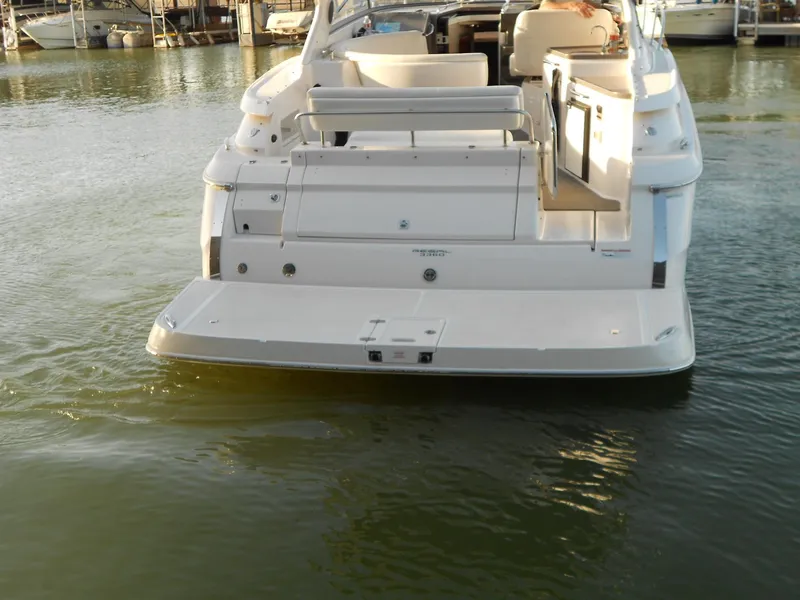 Slide: The Image of 2007 Regal 3360 Window Express boat docked on calm water. - 24