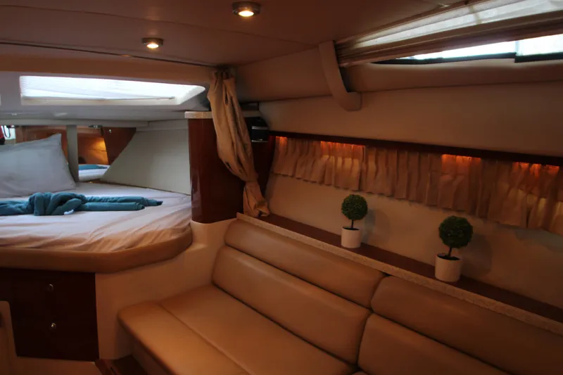 Slide: The Image of Interior of 2007 Regal 3360 Window Express yacht with cozy seating and bed. - 27