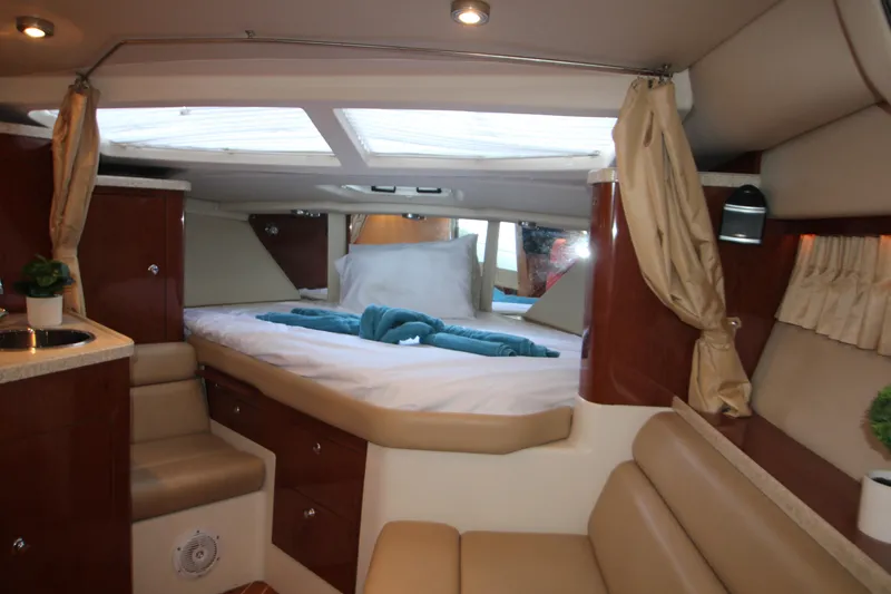 Slide: The Image of Luxurious interior of 2007 Regal 3360 Window Express yacht with cozy bed and elegant decor. - 28