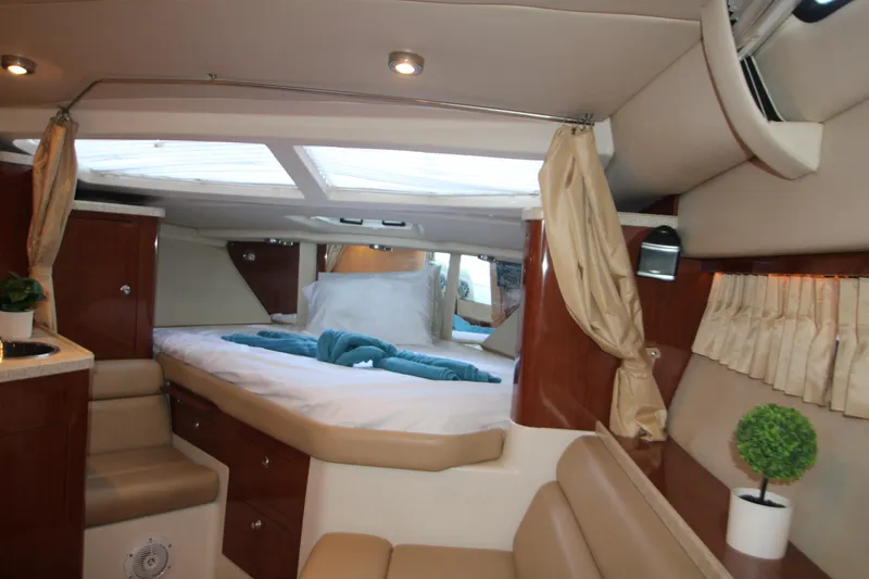 Slide: The Image of Luxurious interior of 2007 Regal 3360 Window Express yacht with cozy seating and elegant decor. - 29