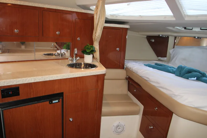 Slide: The Image of 2007 Regal 3360 Window Express cabin interior with kitchenette and bed. - 30