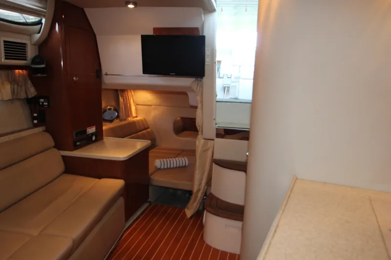 Slide: The Image of Interior of 2007 Regal 3360 Window Express yacht with cozy seating and TV. - 32