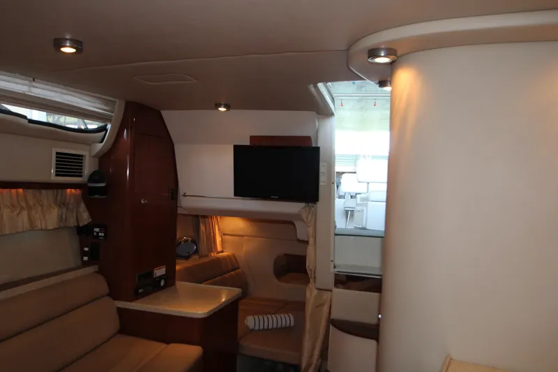 Slide: The Image of Interior of 2007 Regal 3360 Window Express yacht with seating and TV. - 33