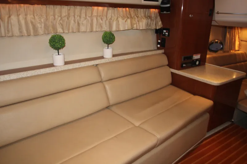 Slide: The Image of Interior of 2007 Regal 3360 Window Express yacht with beige seating and decor. - 34
