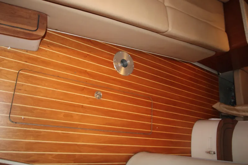 Slide: The Image of 2007 Regal 3360 Window Express interior with wooden flooring and beige seating. - 35