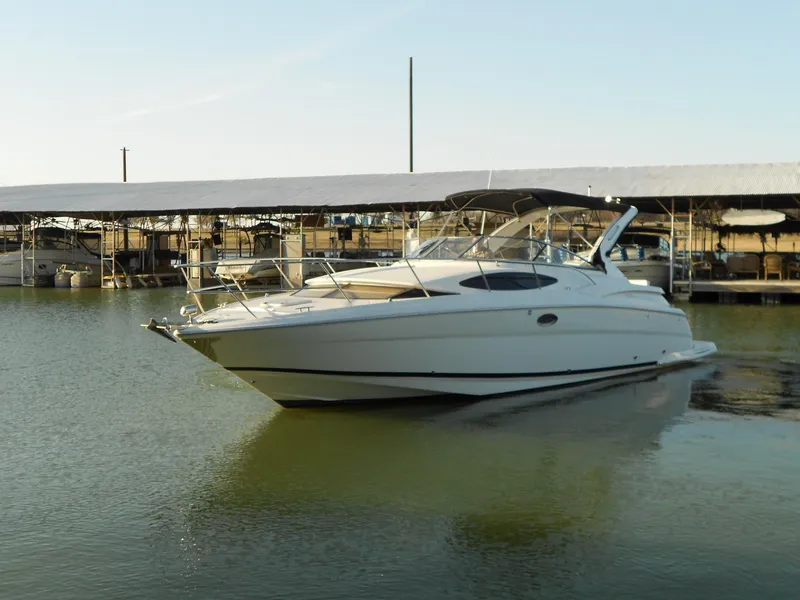 Slide: The Image of 2007 Regal 3360 Window Express boat docked in calm marina waters. - 4