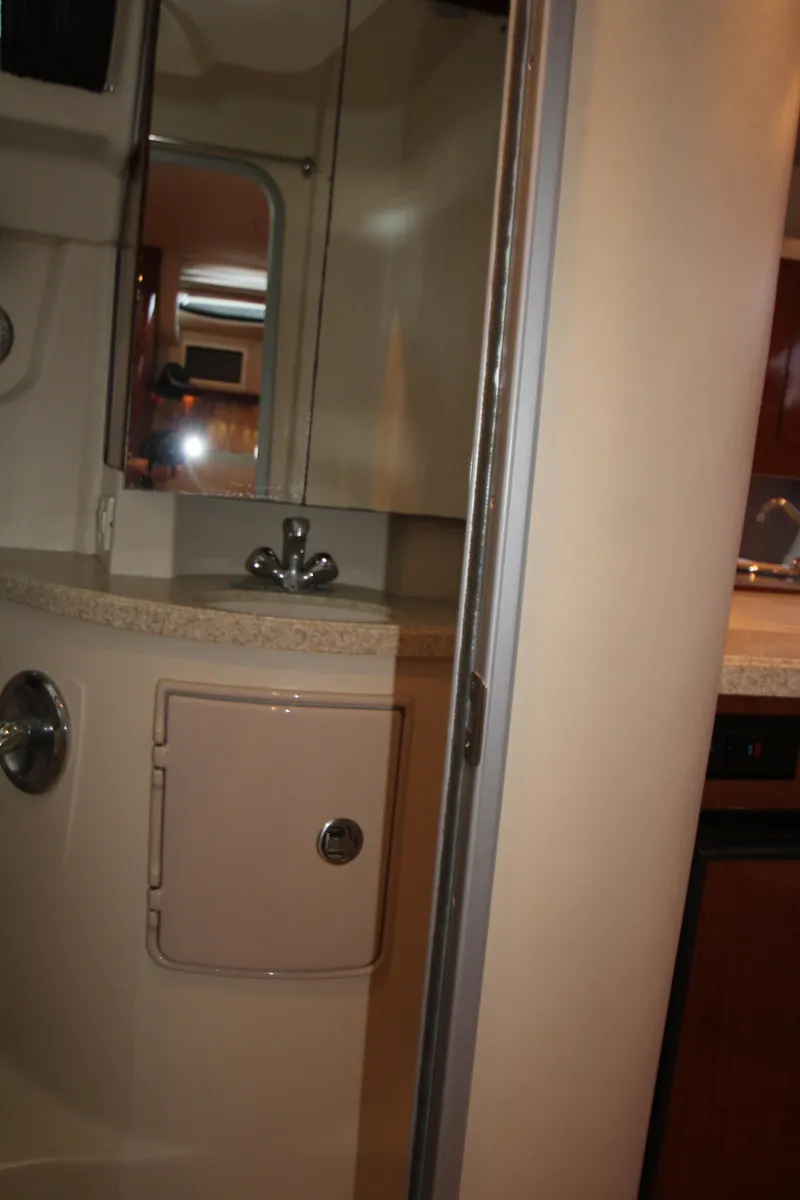 Slide: The Image of Bathroom interior of 2007 Regal 3360 Window Express yacht, featuring sink and mirror. - 40