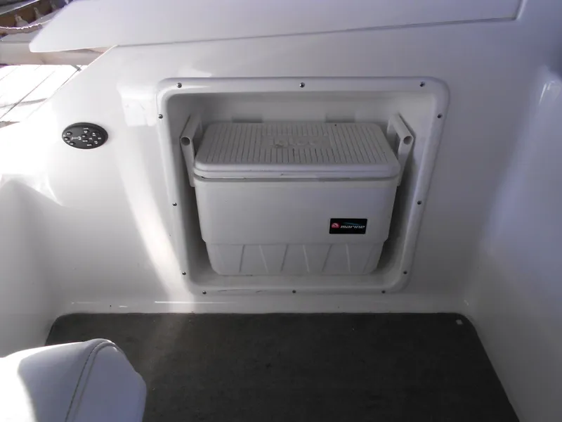 Slide: The Image of 2007 Regal 3360 Window Express boat interior with built-in cooler storage compartment. - 43