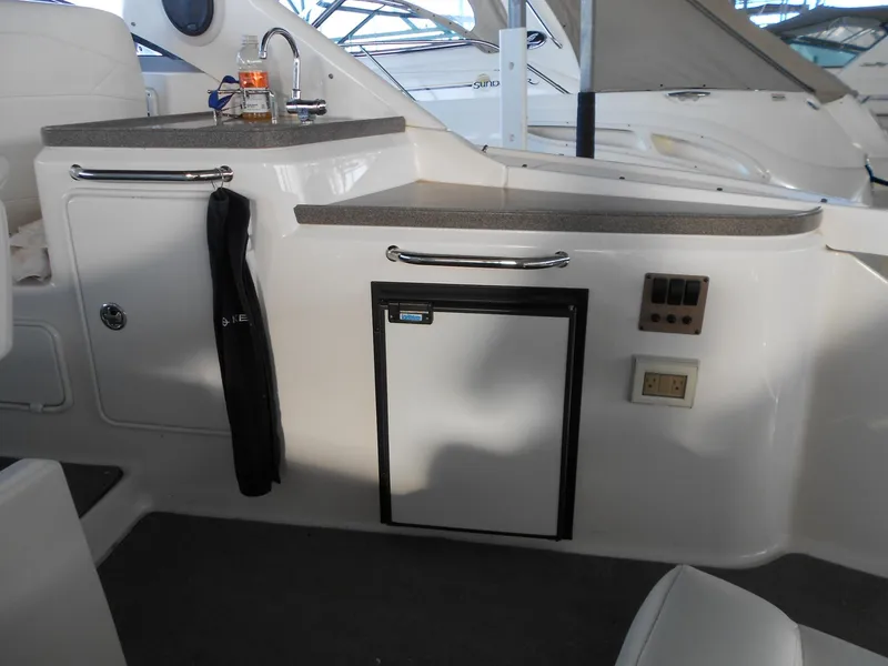 Slide: The Image of 2007 Regal 3360 Window Express boat interior with kitchenette and mini fridge. - 45