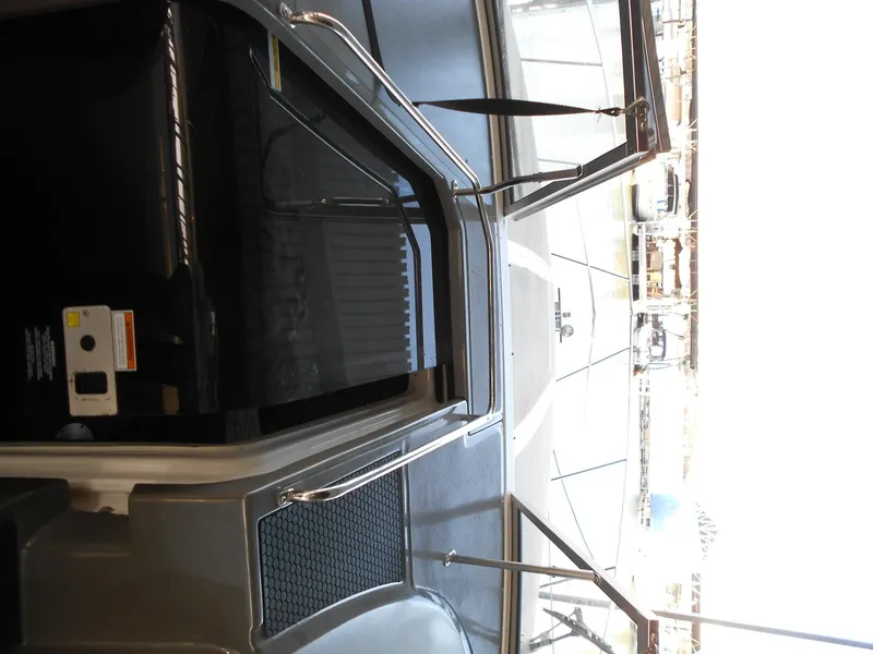 Slide: The Image of 2007 Regal 3360 Window Express boat interior with open hatch and visible deck. - 46