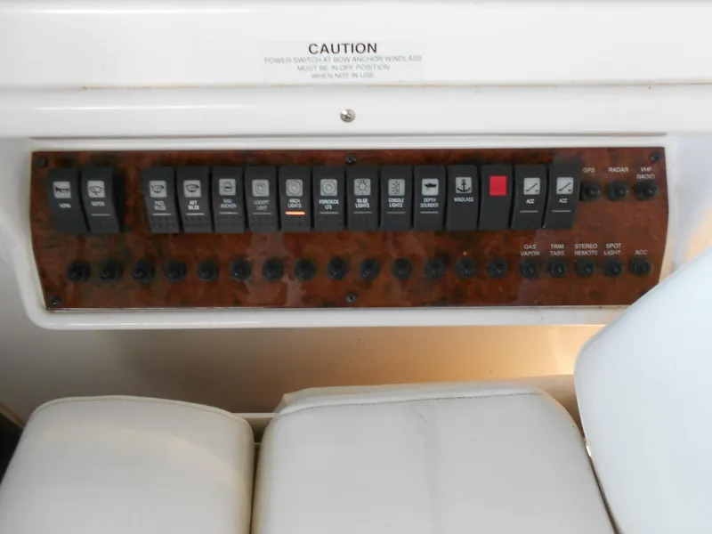 Slide: The Image of Control panel of a 2007 Regal 3360 Window Express boat with labeled switches. - 48