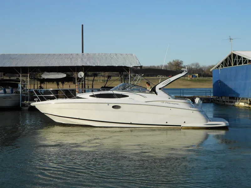 Slide: The Image of 2007 Regal 3360 Window Express boat docked on calm water. - 6