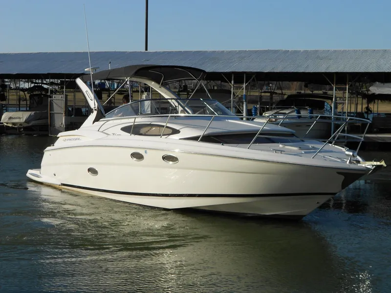 Slide: The Image of 2007 Regal 3360 Window Express boat docked in marina, side view. - 7