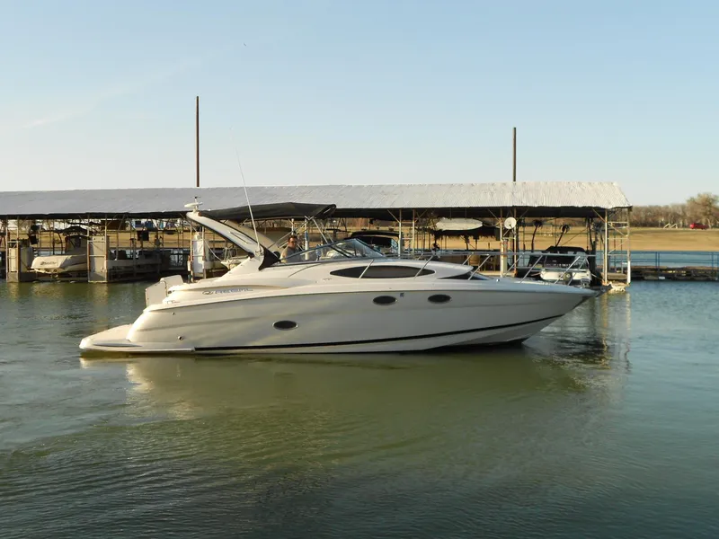 Slide: The Image of 2007 Regal 3360 Window Express yacht docked on calm water. - 8