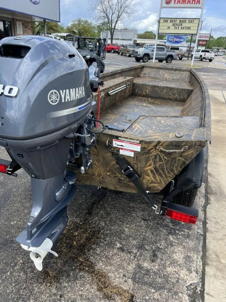 Slide: The Image of Camouflage boat with Yamaha motor, G3 16 dk model, 2025, parked at dealership. - 22