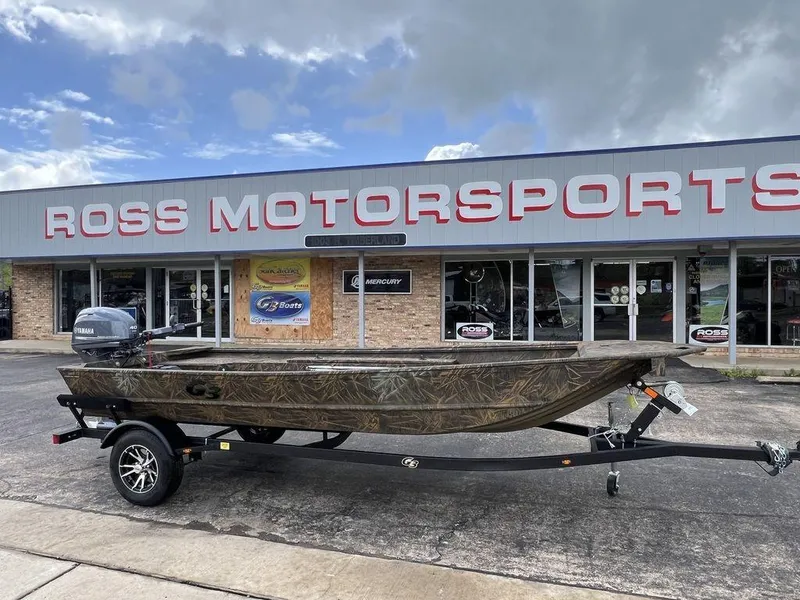 Slide: The Image of 2025 G3 16 dk boat on trailer outside Ross Motorsports dealership. - 3
