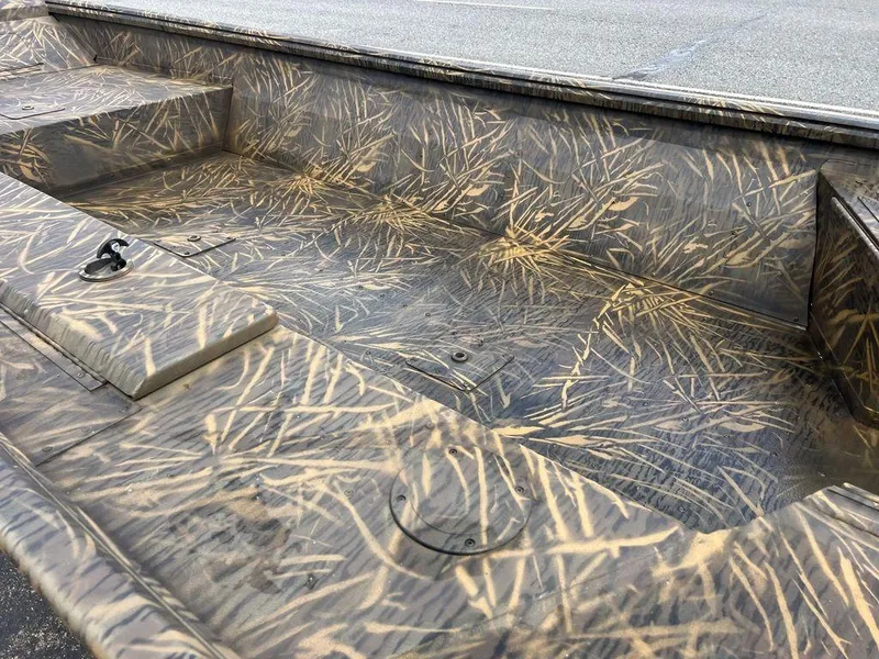 Slide: The Image of Camouflage interior of a 2025 G3 16 dk boat, featuring a grass pattern design. - 31