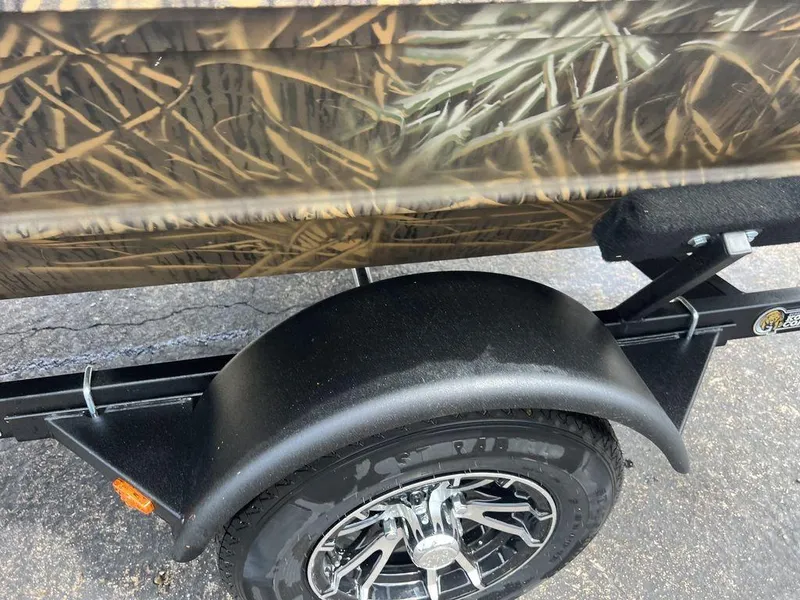 Slide: The Image of Camouflage-patterned G3 16 dk trailer with black wheel and fender, 2025 model. - 35