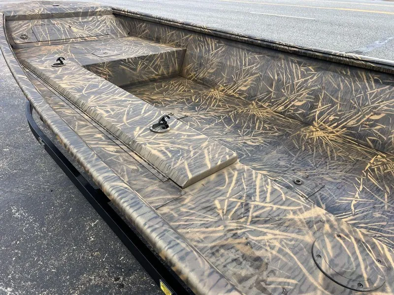 Slide: The Image of Camouflage-patterned interior of 2025 G3 16 dk boat, featuring seating and storage compartments. - 36