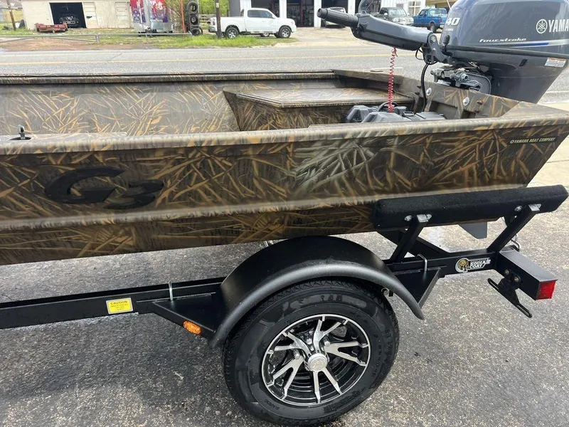 Slide: The Image of Camo-patterned G3 16 dk boat with Yamaha motor on a trailer, 2025 model. - 39