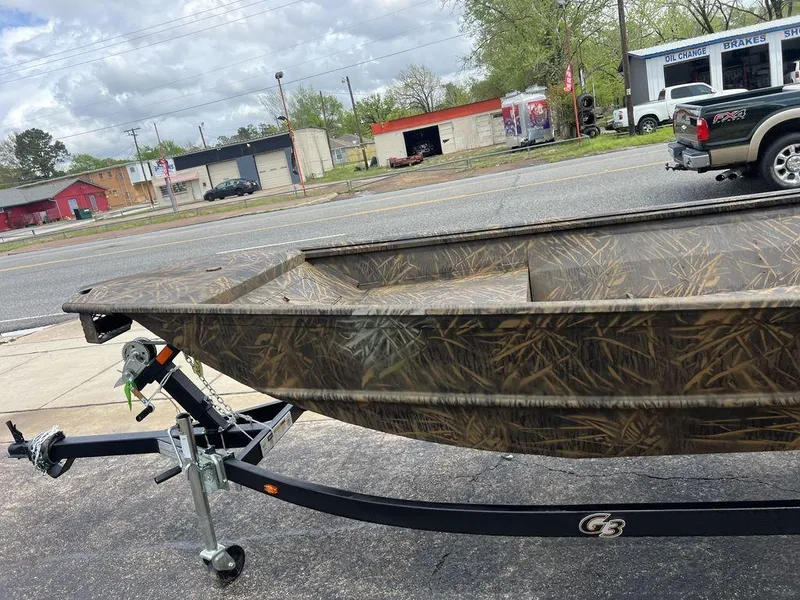Slide: The Image of Camouflage-patterned G3 16 dk boat on trailer, parked roadside, 2025 model. - 40