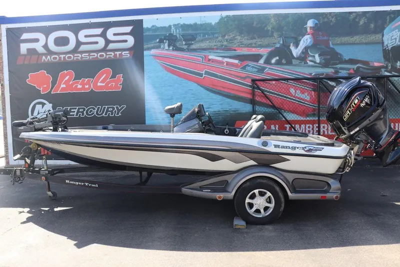 Slide: The Image of 2011 Ranger 518 boat at Ross Motorsports, featuring a powerful outboard motor. - 1