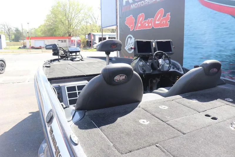 Slide: The Image of 2011 Ranger 518 boat interior with dual seats and advanced navigation equipment. - 17