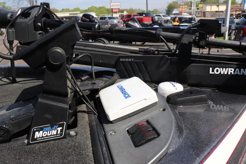 Slide: The Image of 2011 Ranger 518 boat with Lowrance electronics and mount, parked outdoors. - 23