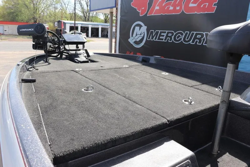 Slide: The Image of 2011 Ranger 518 boat deck with Lowrance equipment, featuring a spacious, carpeted surface. - 28