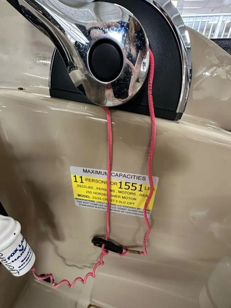 Slide: The Image of Control panel of 2018 Crest Classic 230 SLC boat with capacity label. - 10